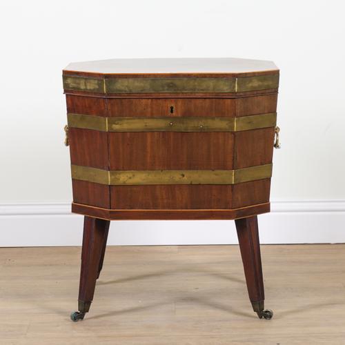 A GEORGE III BRASS BOUND MAHOGANY HEXAGONAL CELLARETTE ON STAND