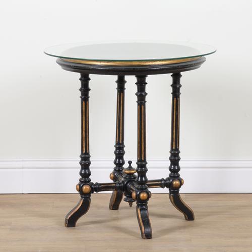 ROBERT STRAHAN AND CO DUBLIN; A VICTORIAN EBONISED PARCEL GILT CIRCULAR OCCASIONAL TABLE