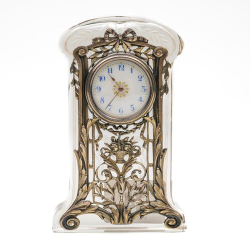 A GERMAN SILVER MOUNTED GLASS MINIATURE MANTEL CLOCK