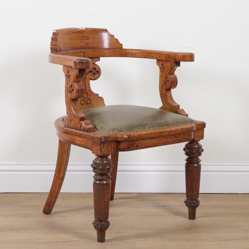 A VICTORIAN OAK FRAMED TUB BACK DESK CHAIR