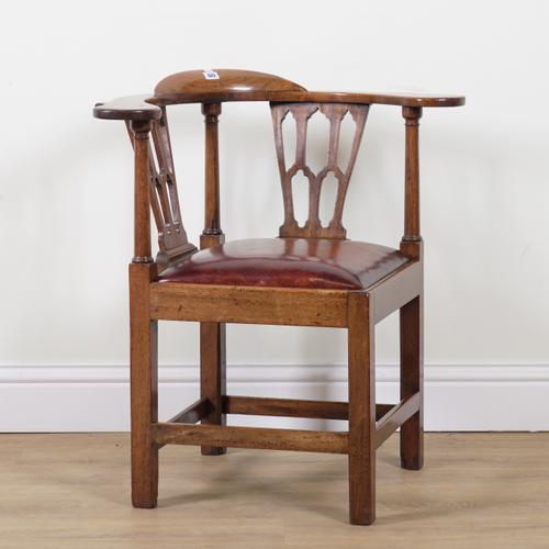 A GEORGE II MAHOGANY FRAMED CORNER CHAIR