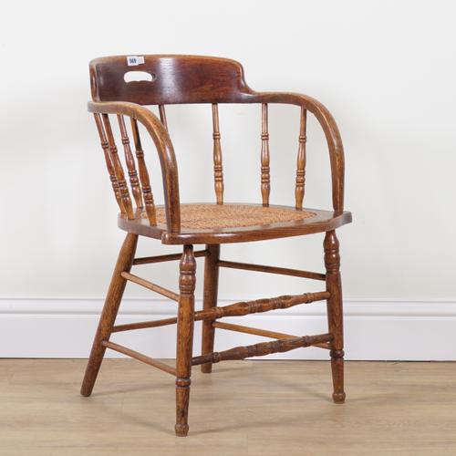 AN EARLY 20TH CENTURY OAK FRAMED TUB BACK DESK CHAIR