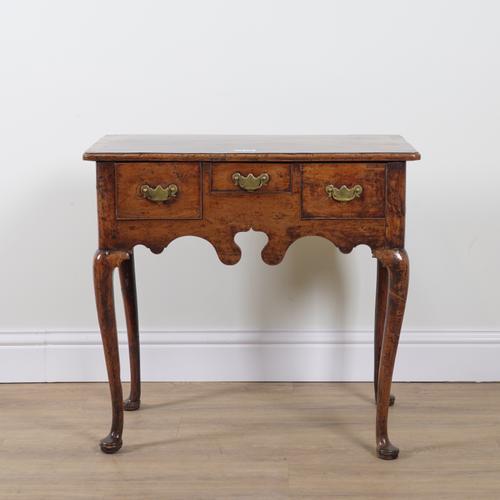 A GEORGE II FRUITWOOD AND YEW THREE DRAWER LOW BOY