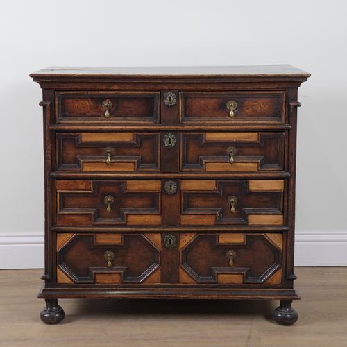 A CHARLES II OAK CHEST OF DRAWERS
