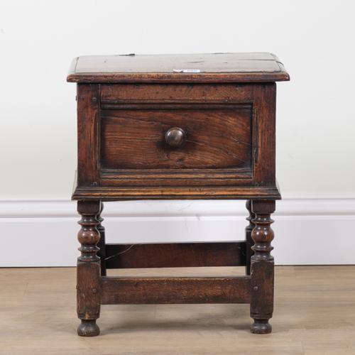 A 17TH CENTURY OAK LIFT TOP BOX STOOL