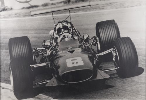 A LARGE PHOTGRAPHIC FERRARI MODEL 312 CAR NO 8 POSTER