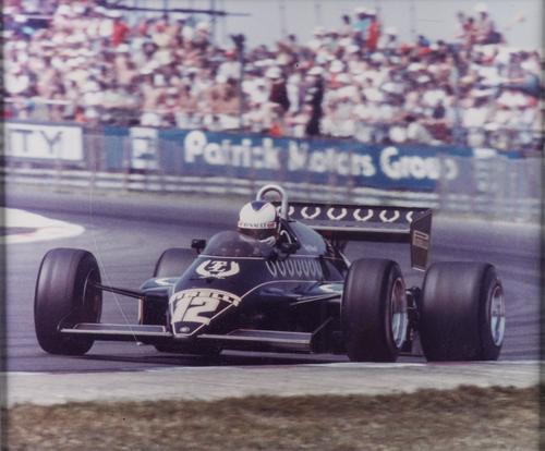 A NIGEL MANSELL LOTUS 91 AT THE SILVERSTONE GRAND PRIX 1982 POSTER FRAMED (2)