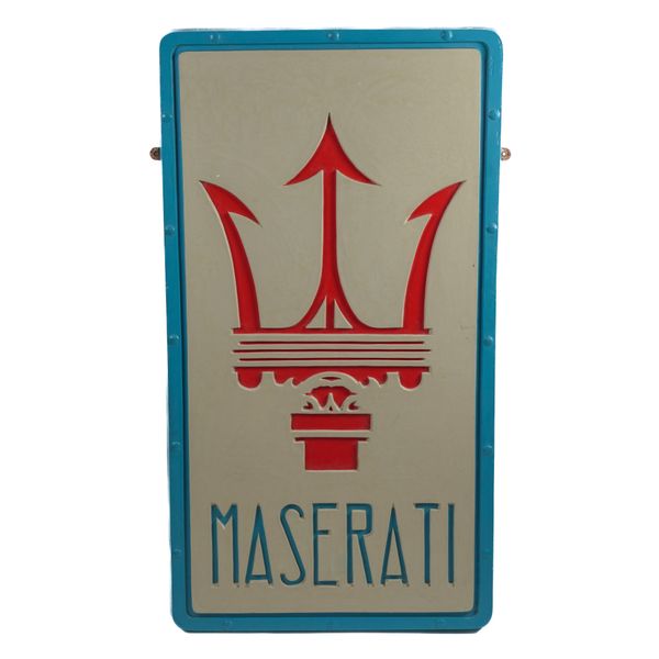 AN OVERSIZED MASERATI BADGE