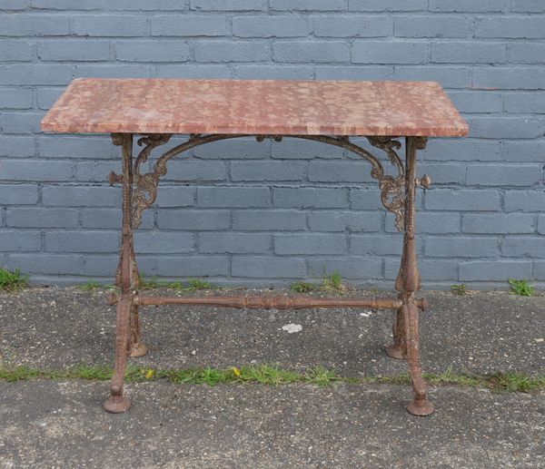 A RECTANGULAR ROUGE MARBLE TOPPED GARDEN TABLE ON FOLIATE CAST METAL BASE