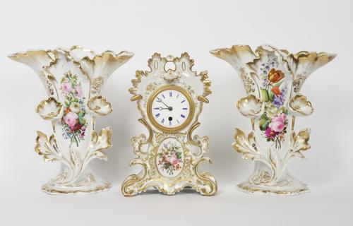 AN ASSEMBLED FRENCH PORCELAIN CLOCK GARNITURE (3)