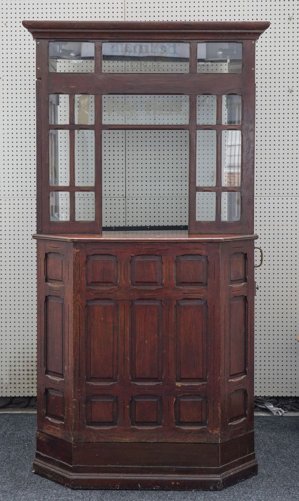 A STAINED PANELLED OAK AND GLASS THEATRE BOOTH