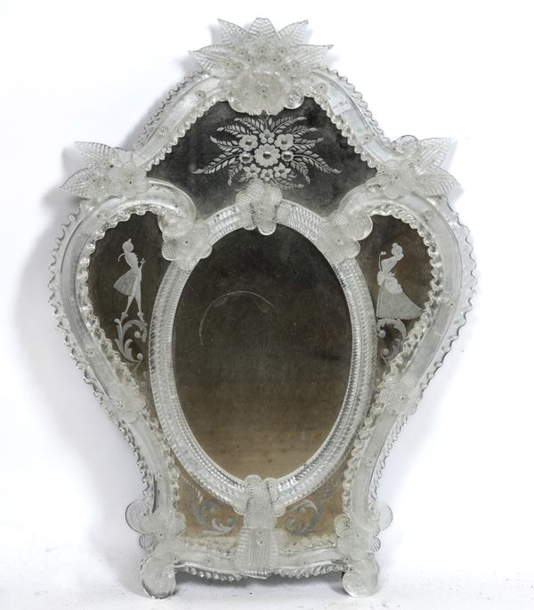 AN EARLY 20TH CENTURY VENETIAN ETCHED AND MOULDED GLASS SHAPED MIRROR