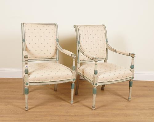 A PAIR OF LOUIS XVI STYLE POLYCHROME PAINTED OPEN ARMCHAIRS (2)