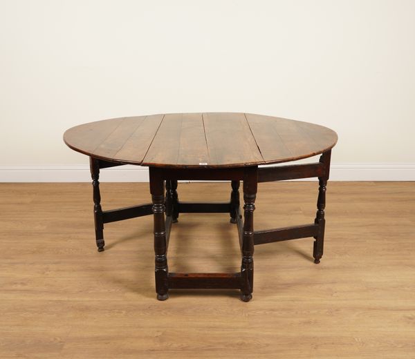 A 17TH CENTURY OAK GATELEG DINING TABLE