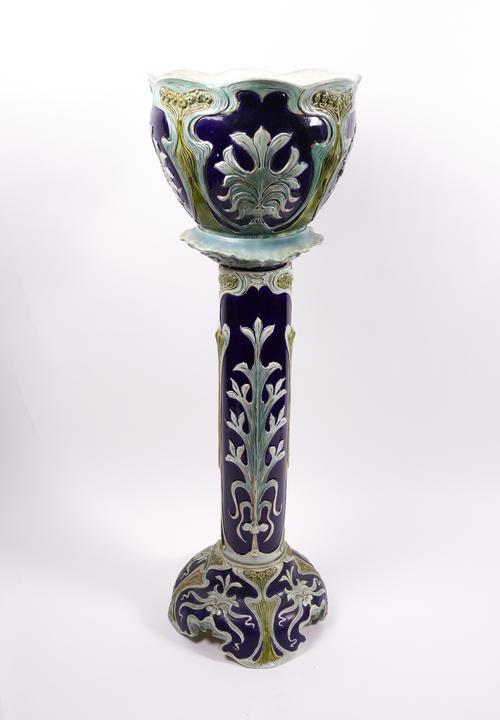 AN EARTHENWARE JARDINIERE AND PEDESTAL (2)