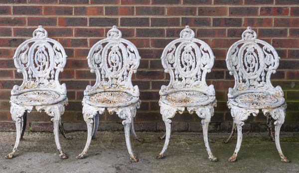 A SET OF FOUR VICTORIAN WHITE PAINTED CAST IRON GARDEN CHAIRS (4)