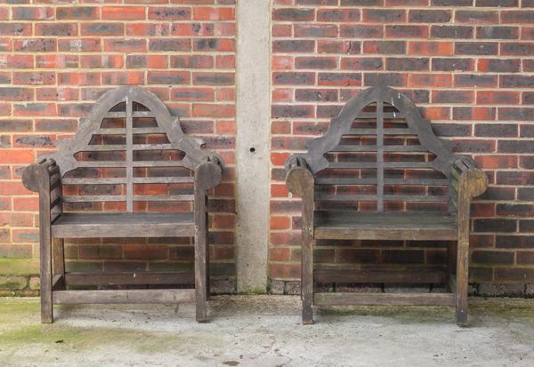 A PAIR OF LUTYENS HARDWOOD GARDEN ARMCHAIRS (2)