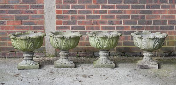 A SET OF FOUR RECONSTITUTED STONE ACANTHUS MOULDED GARDEN URNS (4)