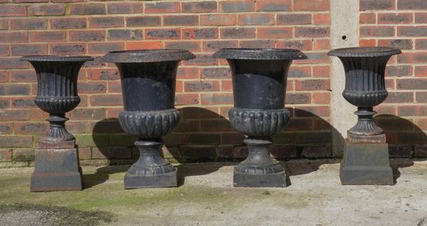 A PAIR OF VICTORIAN BLACK PAINTED CAST IRON GARDEN URNS (4)