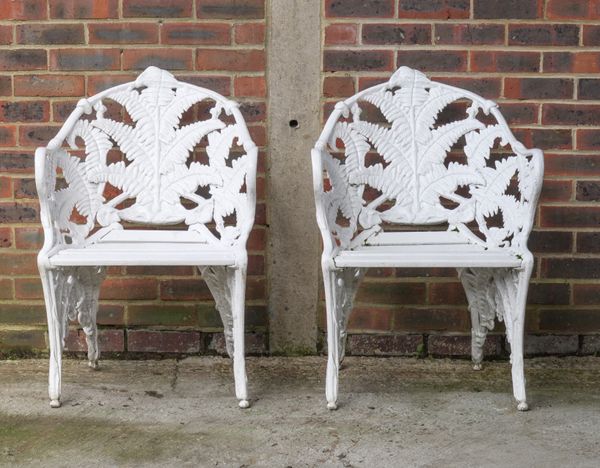 A PAIR OF WHITE PAINTED CAST ALUMINIUM FERN PATTERN GARDEN ARMCHAIRS (2)