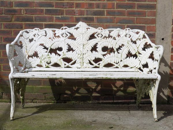 A COALBROOKDALE STYLE CAST IRON FERN AND BERRY PATTERN GARDEN BENCH