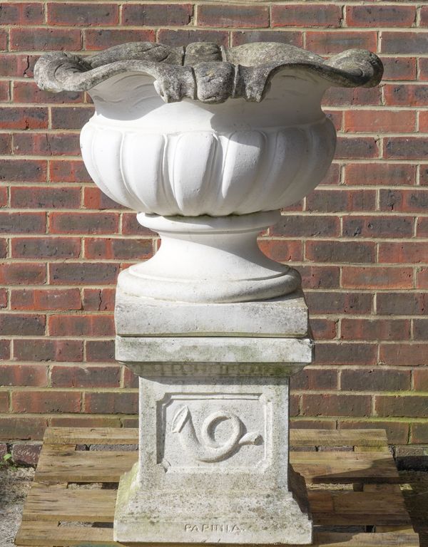 A RECONSTITUTED STONE GARDEN URN