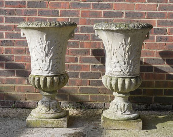 A PAIR OF RECONSTITUTED STONE GARDEN URNS (2)