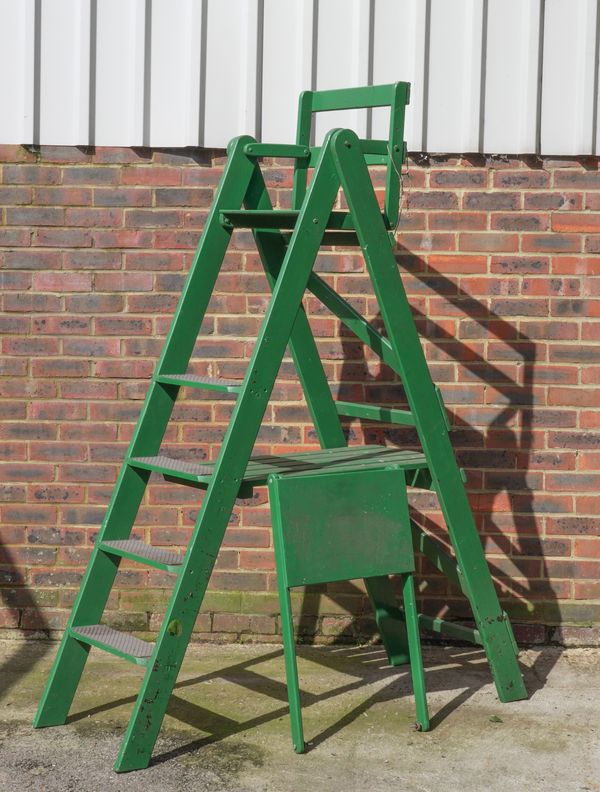 A GREEN PAINTED A-FRAME TENNIS UMPIRE CHAIR