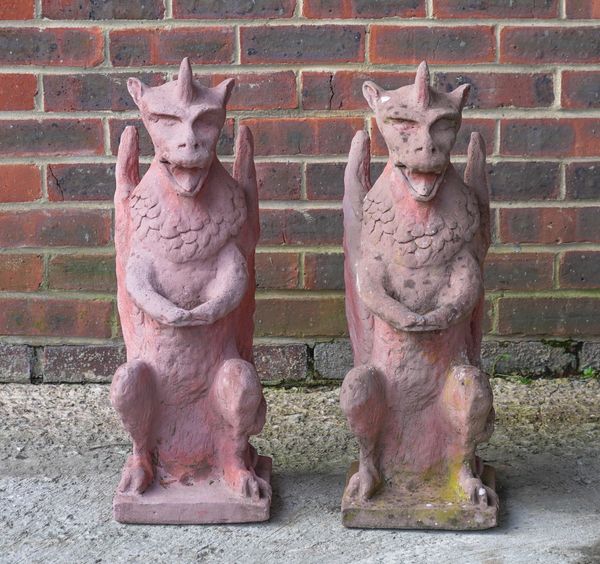 A PAIR OF FAUX TERRACOTTA RECONSTITUTED STONE GARGOYLES (2)