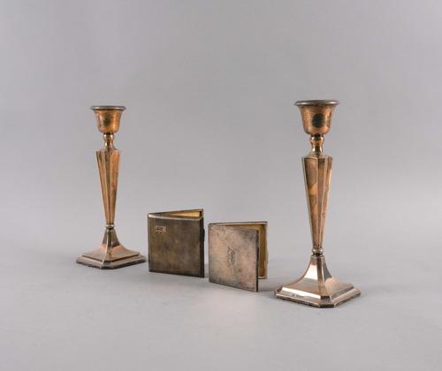 A PAIR OF SILVER CANDLESTICKS, A CIGARETTE CASE AND A LADY'S COMPACT (4)