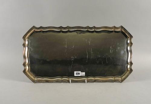A SILVER SHAPED RECTANGULAR TRAY