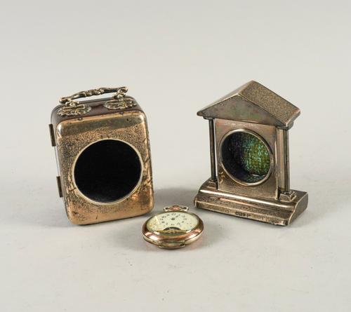 TWO SILVER MOUNTED CLOCK/WATCH STANDS AND A POCKET WATCH (3)