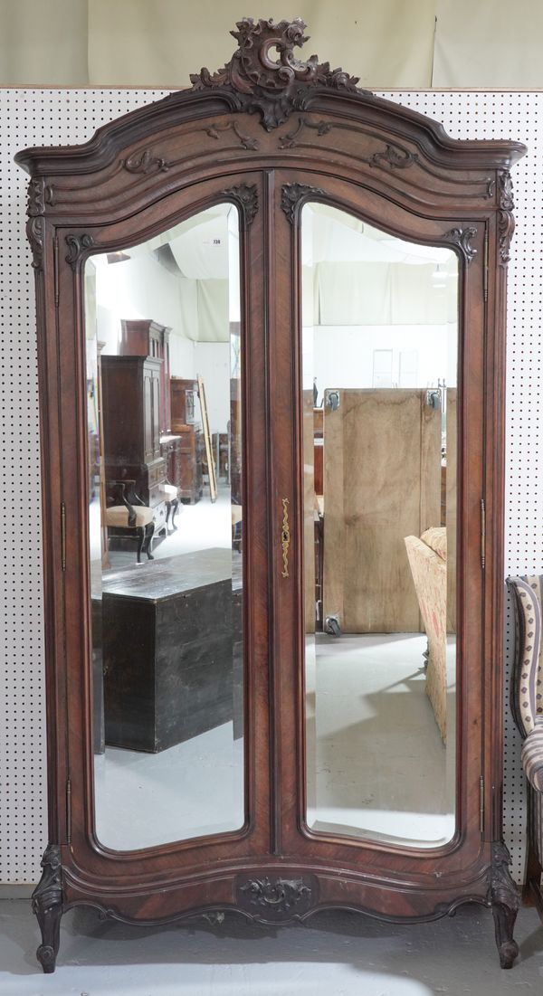 A LATE 19TH CENTURY FRENCH ROSEWOOD ARMOIRE WITH A PAIR OF BEVELLED MIRRORED DOORS