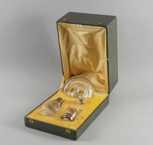 A FRENCH SILVER GILT MOUNTED GLASS CARAFE SET