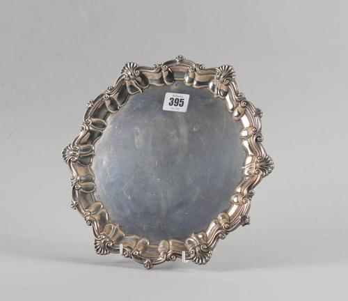 A SILVER SHAPED CIRCULAR SALVER