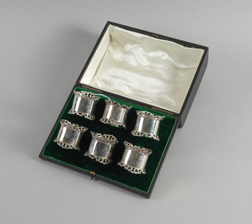 A SET OF SIX SILVER NAPKIN RINGS