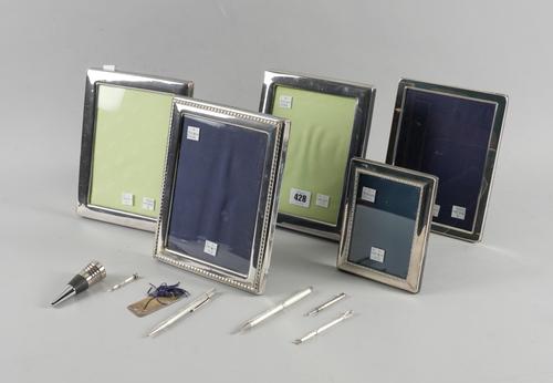 FIVE MODERN SILVER PHOTO FRAMES, FIVE PENS/PENCILS, A BOOKMARK AND A BOTTLE STOPPER (12)