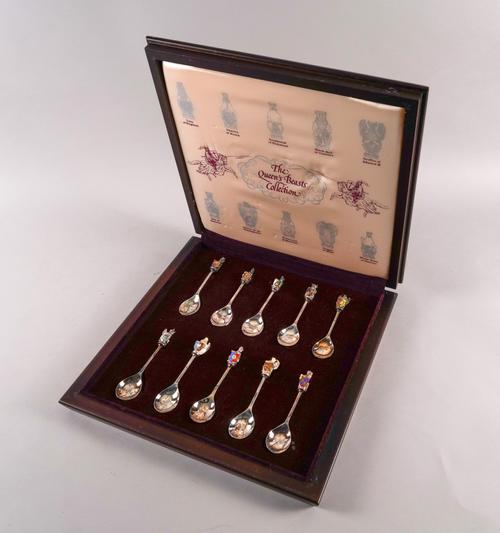 A SET OF TEN SILVER ENAMELLED SPOONS (10)