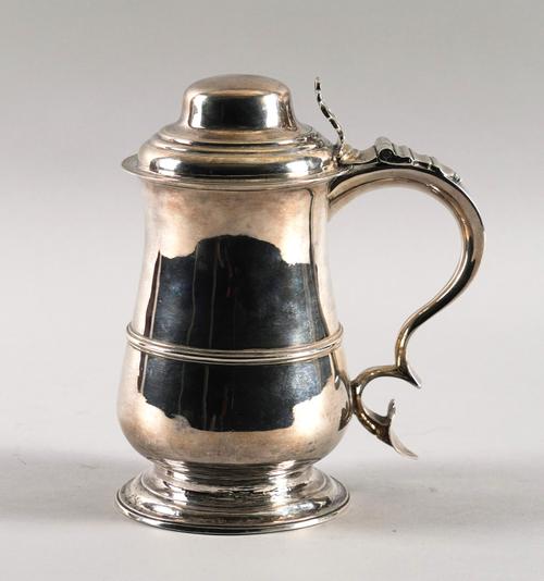 A GEORGE III SILVER TANKARD