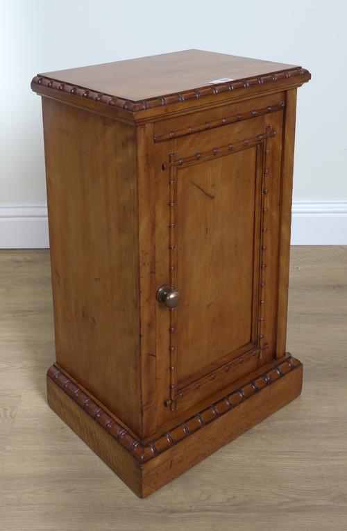 MAPLE AND CO; A SATIN BIRCH BEDSIDE CUPBOARD