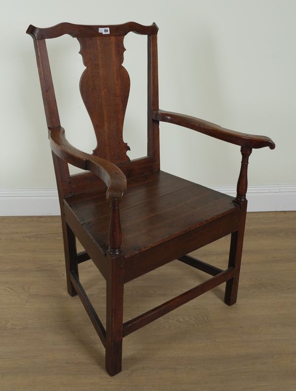 AN EARLY 19TH CENTURY OAK PRIMITIVE VASE BACK OPEN ARMCHAIR