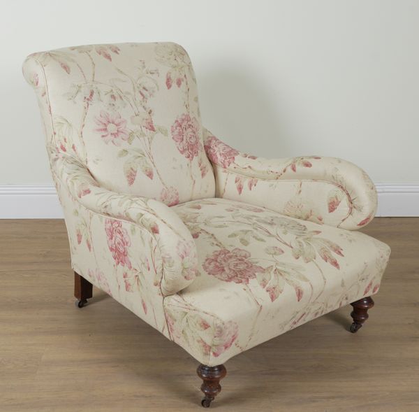 A SHAPED VICTORIAN MAHOGANY FRAMED EASY ARMCHAIR