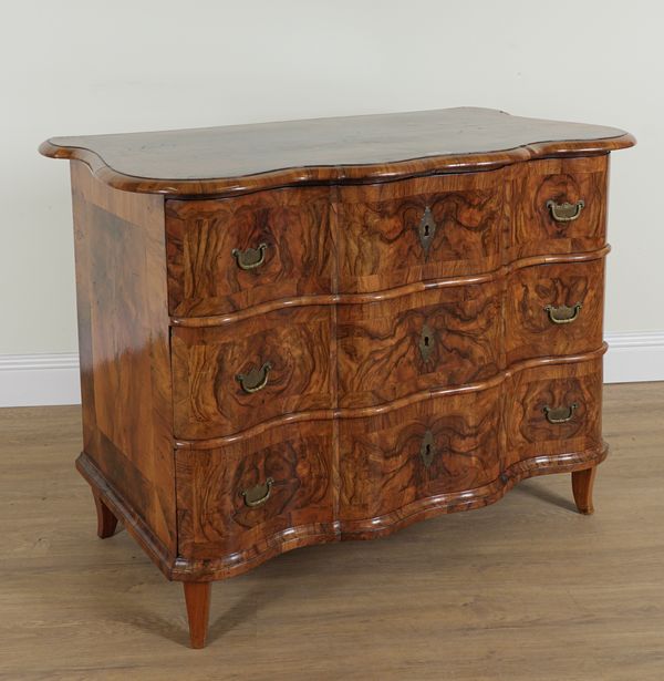 A 17TH CENTURY EUROPEAN  WALNUT SERPENTINE THREE DRAWER COMMODE