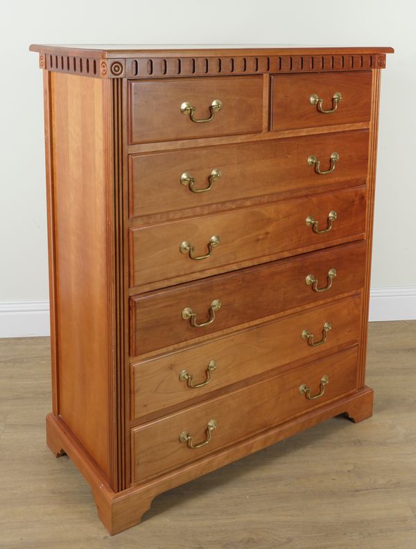 A 20TH CENTURY FOUR PIECE FRUITWOOD BEDROOM SUITE, COMPRISING TWO CHESTS OF DRAWERS AND A PAIR OF BEDSIDE CHESTS (4)