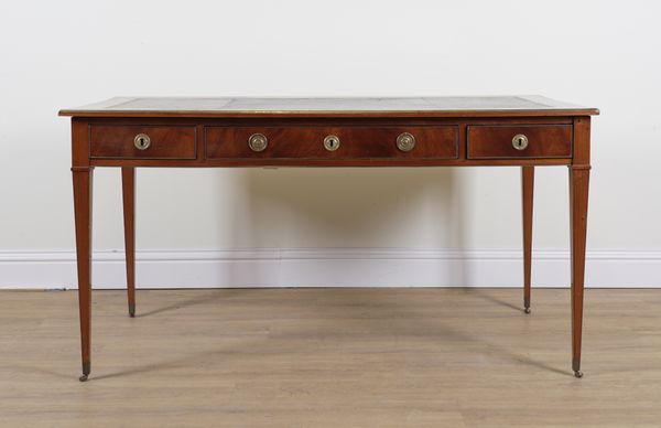 A 19TH CENTURY FRENCH GILT METAL MOUNTED MAHOGANY THREE DRAWER WRITING TABLE