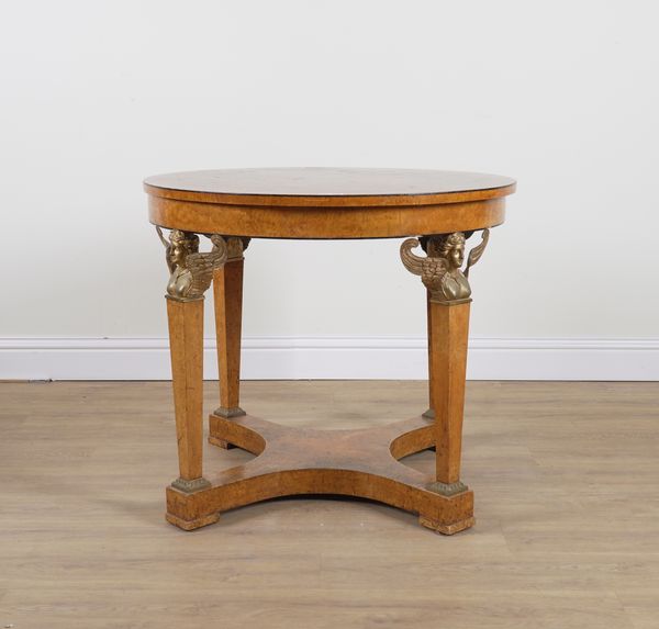 A 19TH CENTURY CONTINENTAL FIGURED WALNUT CIRCULAR CENTRE TABLE