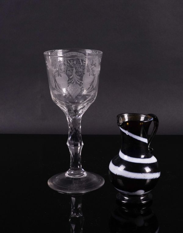 A TALL ENGRAVED FACET STEMMED GOBLET (2)