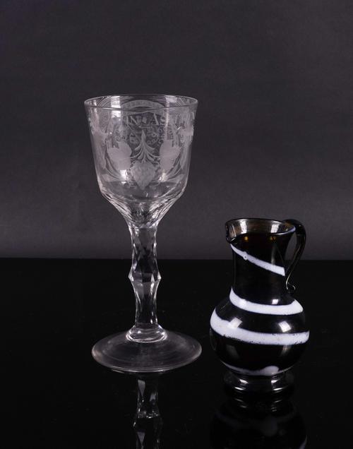 A TALL ENGRAVED FACET STEMMED GOBLET (2)
