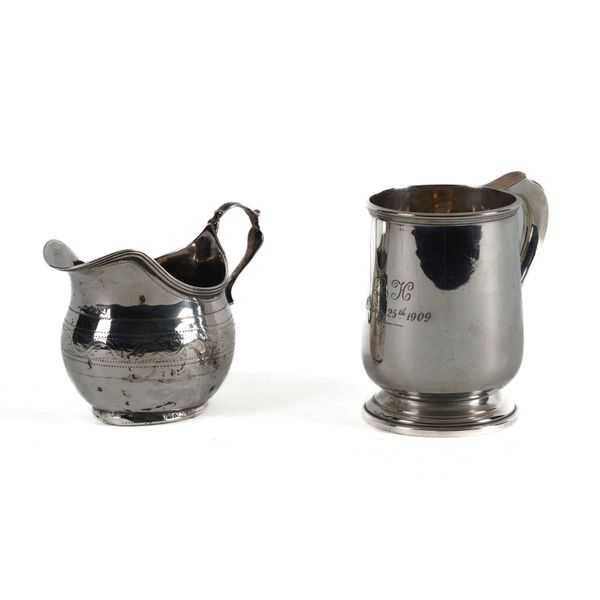 A SILVER MUG AND A SILVER CREAM JUG (2)