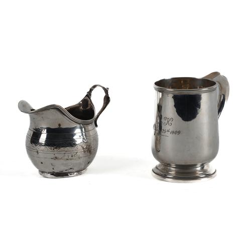 A SILVER MUG AND A SILVER CREAM JUG (2)